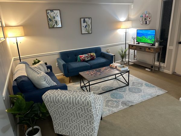 Downstairs waiting room couch painting front door puzzle heart of therapy counseling mental health