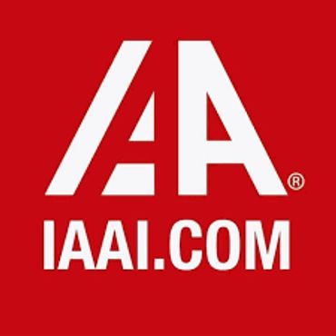 IAAI logo on a red background with website URL.