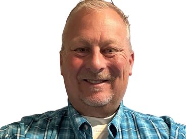 Smiling man in blue plaid shirt.