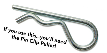 Close-up of a metal pin clip with a text warning about needing a pin clip puller.