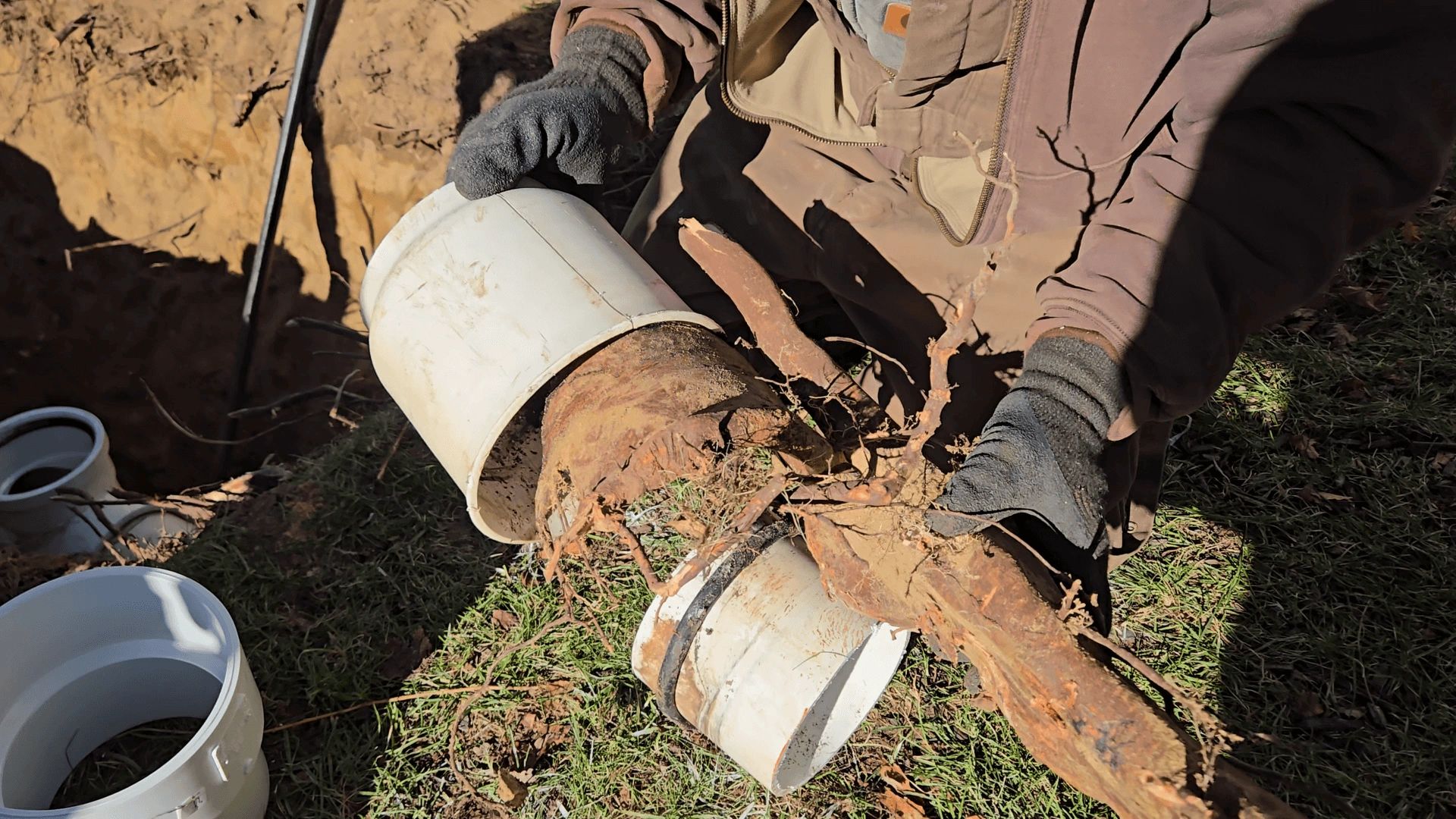 Liberty Plumbing crew repairing a sewer line pipe in Ellington, CT