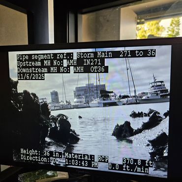 Pipeline inspection showing end of pipe into harbor.