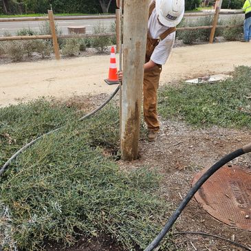 A worker hydro excavating.