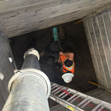 Worker performing a pipe repair.