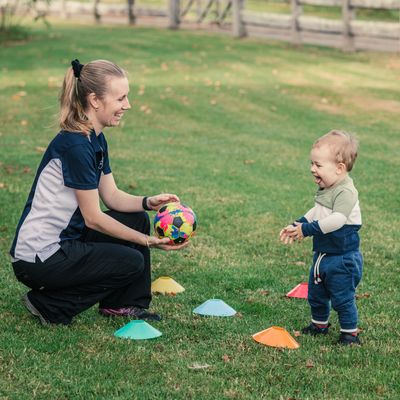 Jess Paediatric Physiotherapist playing with ball and toddler