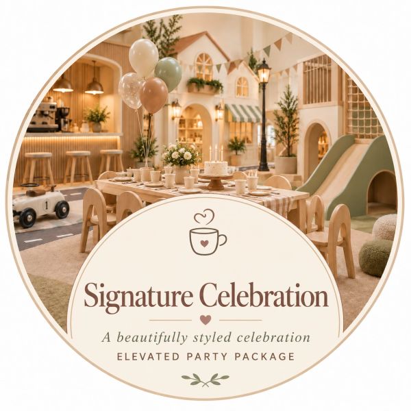 Elegant Signature Celebration party setup with balloons and cake.