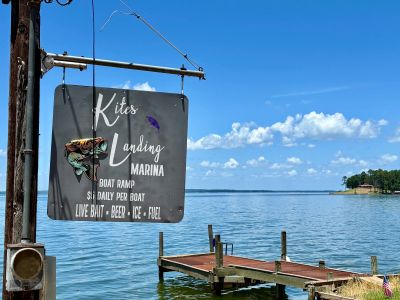 Sign for Kites Landing Marina by lakeside dock.
