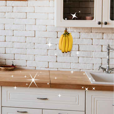 A view of kitchen cabinet with a banana holder