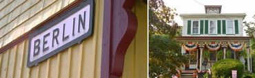 A sign reading 'BERLIN' on a yellow building and a decorated house with a porch.