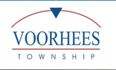 Logo of Voorhees Township with a blue triangle and red arc.