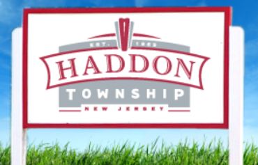 Welcome sign for Haddon Township, New Jersey under a blue sky.