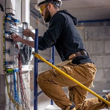 Ring Electric licensed electrician performing safe wiring service inside Ottawa home
