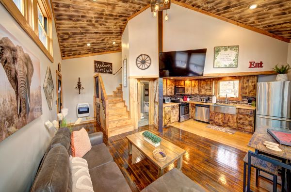 Cozy rustic kitchen and living area with wooden accents.
