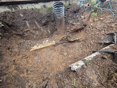 Perimeter drain repair shows damaged drain tile and foundation drainage system repair in Nanaimo, BC