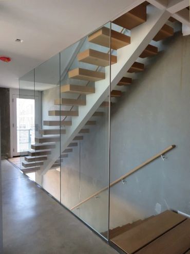 Mono stringer stair case installation for M-rail Canada. Southern shores of Lake Michigan