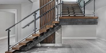 Steel staircase, mono stringers wood treads. Private residence: Brighton, Michigan