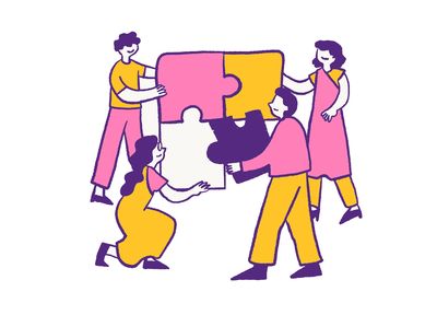 Four people collaboratively assembling a large colorful puzzle.