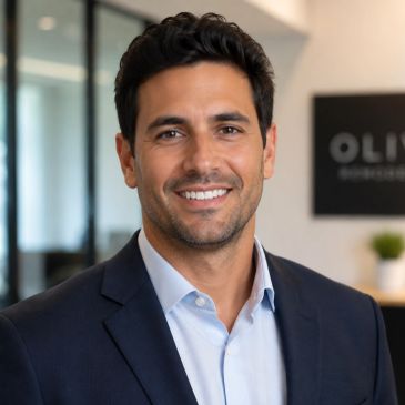 Smiling man in a business suit at office.