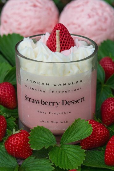 Strawberry dessert scented soy candle with whipped topping and strawberry decoration.