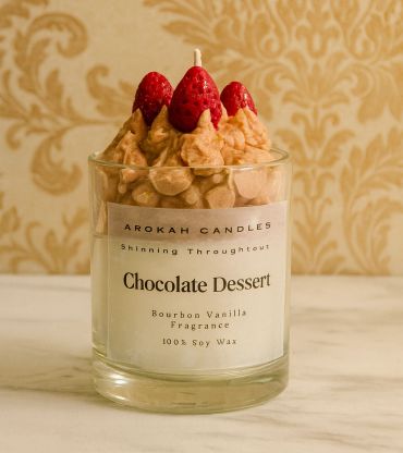 Chocolate dessert scented soy wax candle with strawberry decoration.