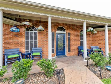 Silver Grace Assisted Living blue front door, brick exterior. 