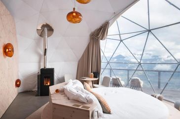 whitepod monthey switzerland alps eco geodesic wood stove panoramic views