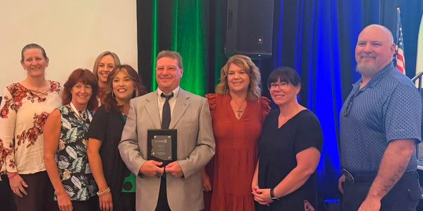 Group photo with an award recipient.