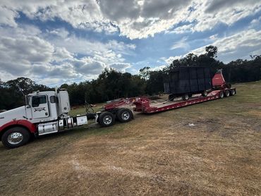 Semi hauling sod farm equipment on 50-ton trailer – ag transport Central Florida | Maximum Towing