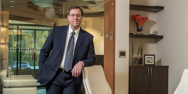 Picture of Bryan Van Cott in the main conference room of the law firm