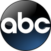 ABC logo with white letters on a dark blue and black circular background.
