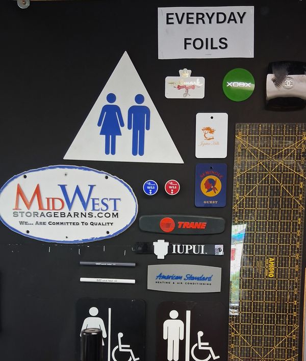Assorted signs and buttons on a black background.