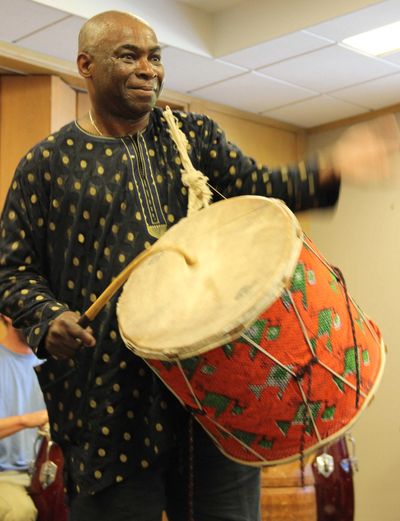 Onye Onyemaechi with a drum