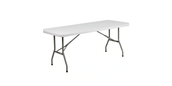 A white folding table with metal legs.