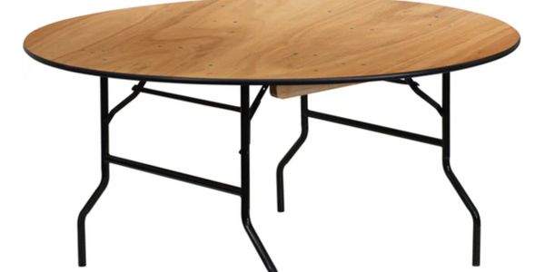 Round wooden table with black metal legs.