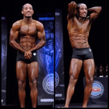 Bodybuilder posing and showing muscles on stage.