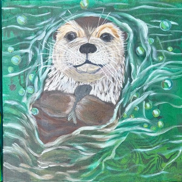 A smiling otter floating in water with bubbles around.