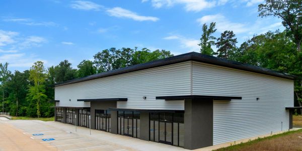 New commercial building with large glass windows.