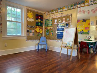 Circle time area of child care and day care classroom with bright colors in Yorktown Heights, NY