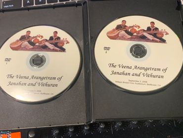 Two DVDs titled 'The Veena Arangetram of Janahan and Vithuran' from 2006.