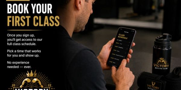 Man booking his first boxing class using a mobile app at Victory Boxing Gym.