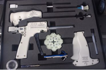 Set of orthopedic surgical tools neatly arranged in protective foam case.