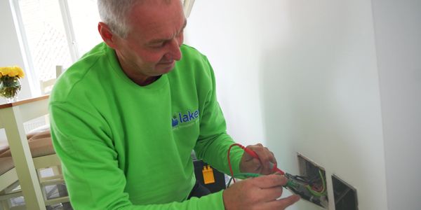 Electrician working inside property