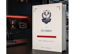 A book titled 'The DVI Bible' by Kevin Tarpley on a desk.