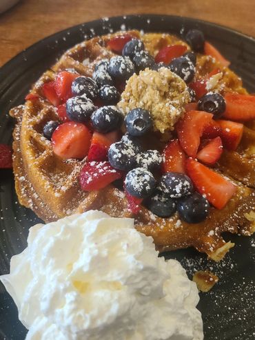 Belgian Waffle with fresh fruits and maple butter.