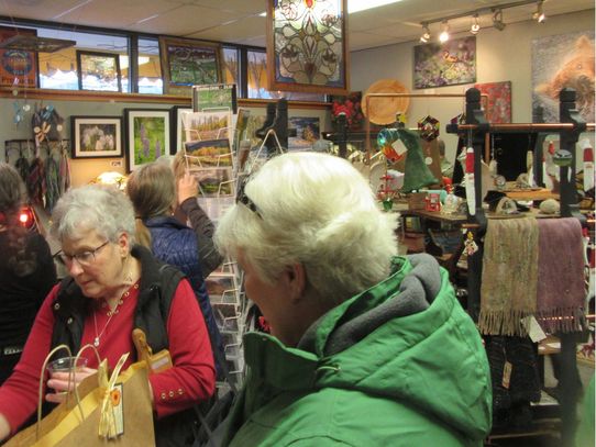 Shoppers enjoy food and wine while mingling with the artists at our annual Holiday Celebration.