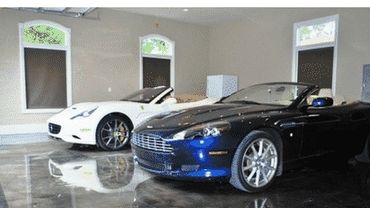 Two luxury convertible cars parked in a glossy showroom.