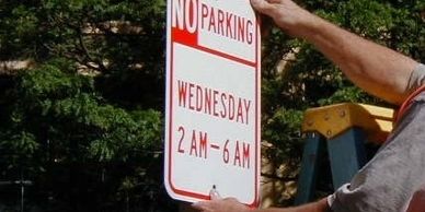 Parking lot sign installation