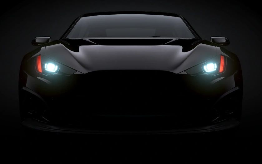 Clear, bright headlights on a black car after restoration