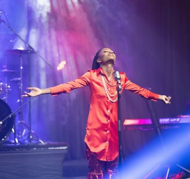 Denise Moyo, poet, singer and songwriter who was born in Zimbabwe singing Eternal Life.