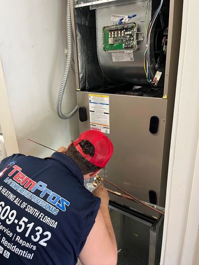 Our skilled technician, Caleb welding a new AC unit.